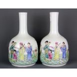 A pair of Chinese hand painted porcelain bottle vases, H. 21cm.