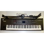 A Yamaha S70XS keyboard synthesizer and stand.