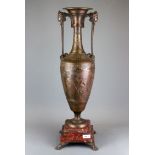A large Art Nouveau classical bronze urn with red marble and bronze base, H. 70cm.