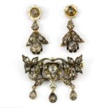 A Victorian yellow and white metal (tested gold and silver brooch and pair of earrings set with rose