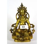 A Tibetan gilt bronze deity figure of Trisong Detsen (742 - 797 AD) 38th King of Tibet, H. 20cm.