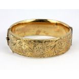 A 1/5th 9ct rolled gold bangle.