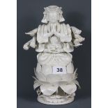An early to mid 20th Century Chinese blanc de chine figure of an eight armed deity, H. 26cm.