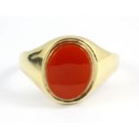 A gentleman's 9ct yellow gold cornelian set signet ring, (K.5).