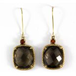 A pair of 9ct yellow gold (stamped 9ct) drop earrings set with checker board cut smokey quartz and