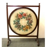 A 1930's mahogany and glass beadwork fire screen, H. 77cm.