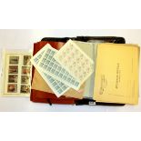 A leather case of Italian and Vatican sheets of stamps and stamped envelopes.