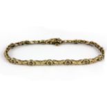 A 9ct yellow gold diamond set bracelet, L. 9cm W. 7.4g.