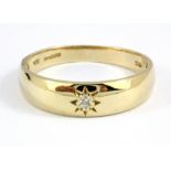 A gentleman's 9ct yellow gold diamond set gipsy ring, (V).