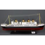 A wooden model of the SS Titanic, L. 49cm.