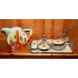 An Art Deco jug and dressing table set.