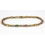 A 9ct yellow gold (stamped 9k) bracelet set with oval cut fancy coloured sapphires and diamonds,