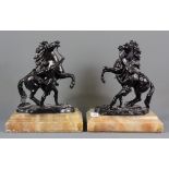 A pair of Marley horses on alabaster bases, H. 24cm.
