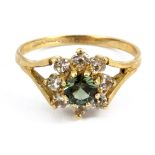 A 9ct yellow gold stone set cluster ring, (P.5).