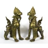 A pair of 19th Century Indian brass/ bronze guardian lion figures, H. 21cm.