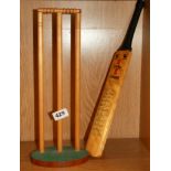 A 1980 Essex County Cricket Club signed miniature bat, L. 43cm and stumps.