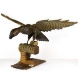 A carved wooden Black Forest figure of an eagle, H. 35cm. Wingspan L. 71cm.