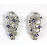 A pair of 925 silver tanzanite and white stone set drop earrings, L. 3.2cm.