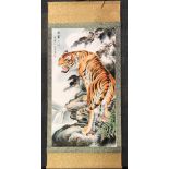 A Chinese silk mounted scroll of a tiger, size 81 x 184cm.
