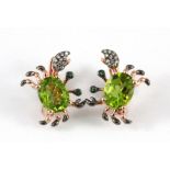 A matching pair of 925 silver rose gold gilt crab shaped earrings set with an oval cut peridot,