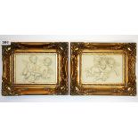 A pair of gilt framed cherub plaques, size 27 x 22cm.