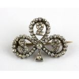 A 19th century yellow and white gold (tested gold and silver) brooch set with old cut diamonds,