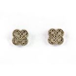 A pair of 18ct white gold (stamped 18ct) diamond set stud earrings, Dia. 0.8cm.