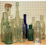 A group of antique glass bottles.