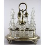 A superb hallmarked silver and cut glass seven bottle Victorian cruet set, W. 27cm H. 28cm. (In