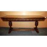 A carved oak refectory style coffee table, size 132 x 57 x 55cm.