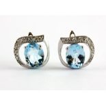 A pair of 925 silver earrings set with oval cut Swiss blue topaz and cubic zirconia, 1.3 x 1.5cm.