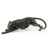 An attractive large cast bronze model of a panther, L. 69cm.