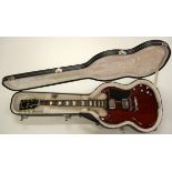 A 2013 Gibson SG cherry finish electric guitar with case.