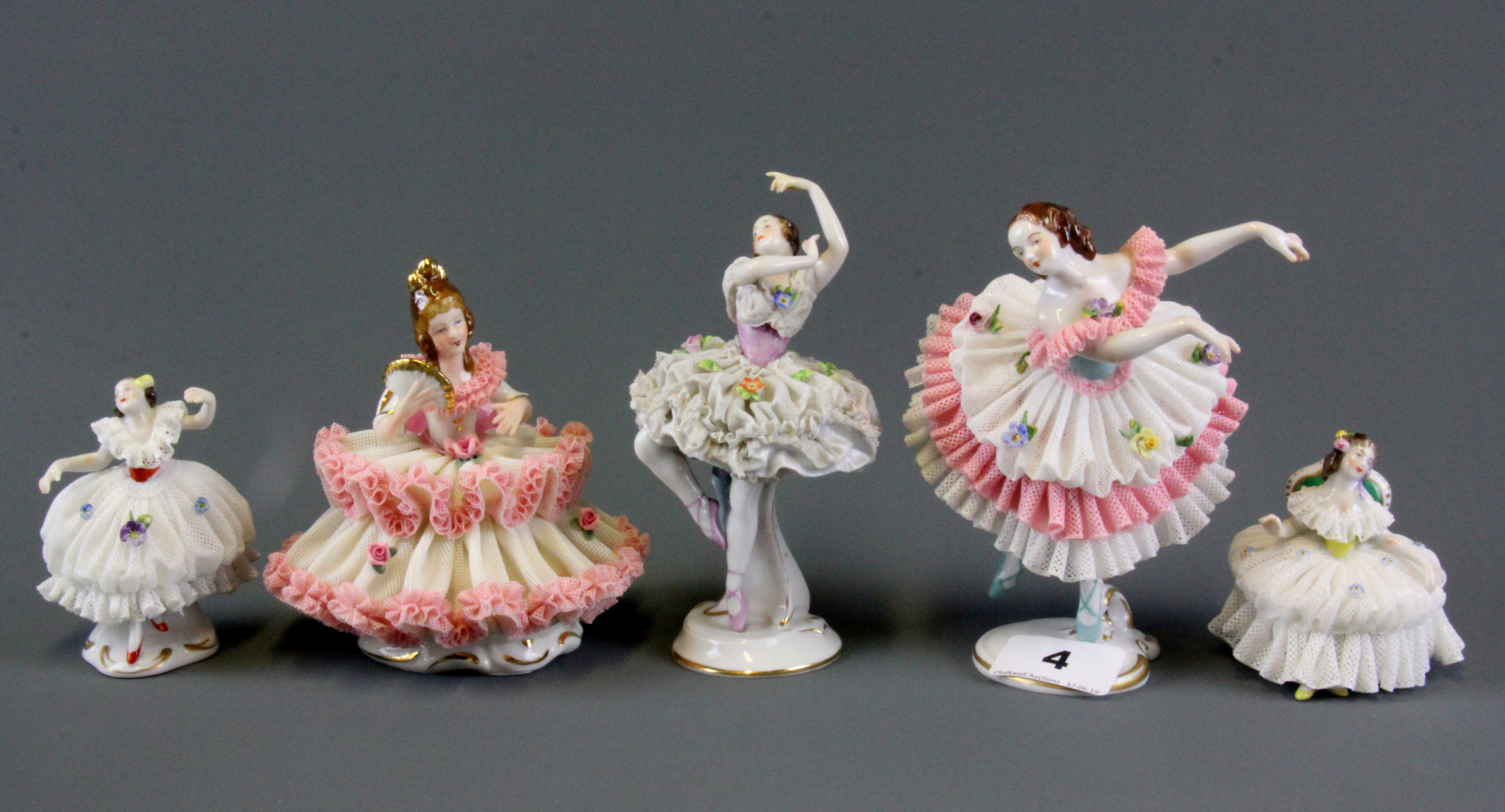 Five Dresden porcelain lace ballerina figures, tallest H. 14cm.