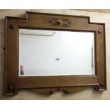 An Arts and Crafts oak framed mirror, size 88 x 68cm.