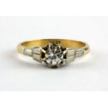 An 18ct yellow gold and platinum diamond set solitaire ring, (M.5).