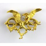 A French yellow metal (tested 18ct gold) griffon shaped brooch set with an old cut diamond, 4 x 3.