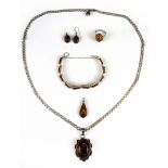 A silver and amber pendant and chain and other silver and amber items.