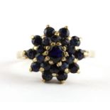 A 9ct yellow gold sapphire set cluster ring, (N).