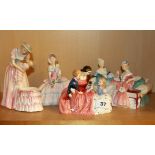 Four Royal Doulton porcelain figurines including 'The Bedtime Story' HN 2059, 'The Love Letter' HN