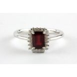 A 925 silver emerald cut ruby and white stone set cluster ring, (N.5).
