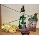 A ceramic table lamp, clock and two other dragon items.