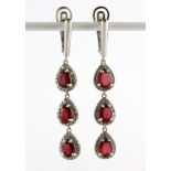 A pair of 925 silver drop earrings set with oval cut rubies and cubic zirconia, L. 5cm.