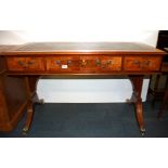 A leather topped mahogany and burr walnut veneered Regency style desk, size 122 x 61 x 78cm.