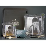 A large boxed Waterford crystal photograph frame, 34 x 29cm together with a further photograph frame