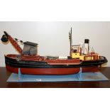 A large motorised wooden model ship, L. 84cm.