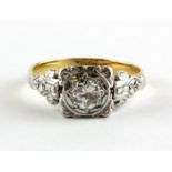 A yellow and white metal (tested 18ct gold) brilliant cut diamond set solitaire ring, approx. 0.