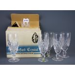 Eleven boxed Waterford crystal champagne glasses, H. 15cm.