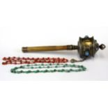 A Tibetan prayer wheel with two strands of 1920's glass beads imitating coral and turquoise, L.