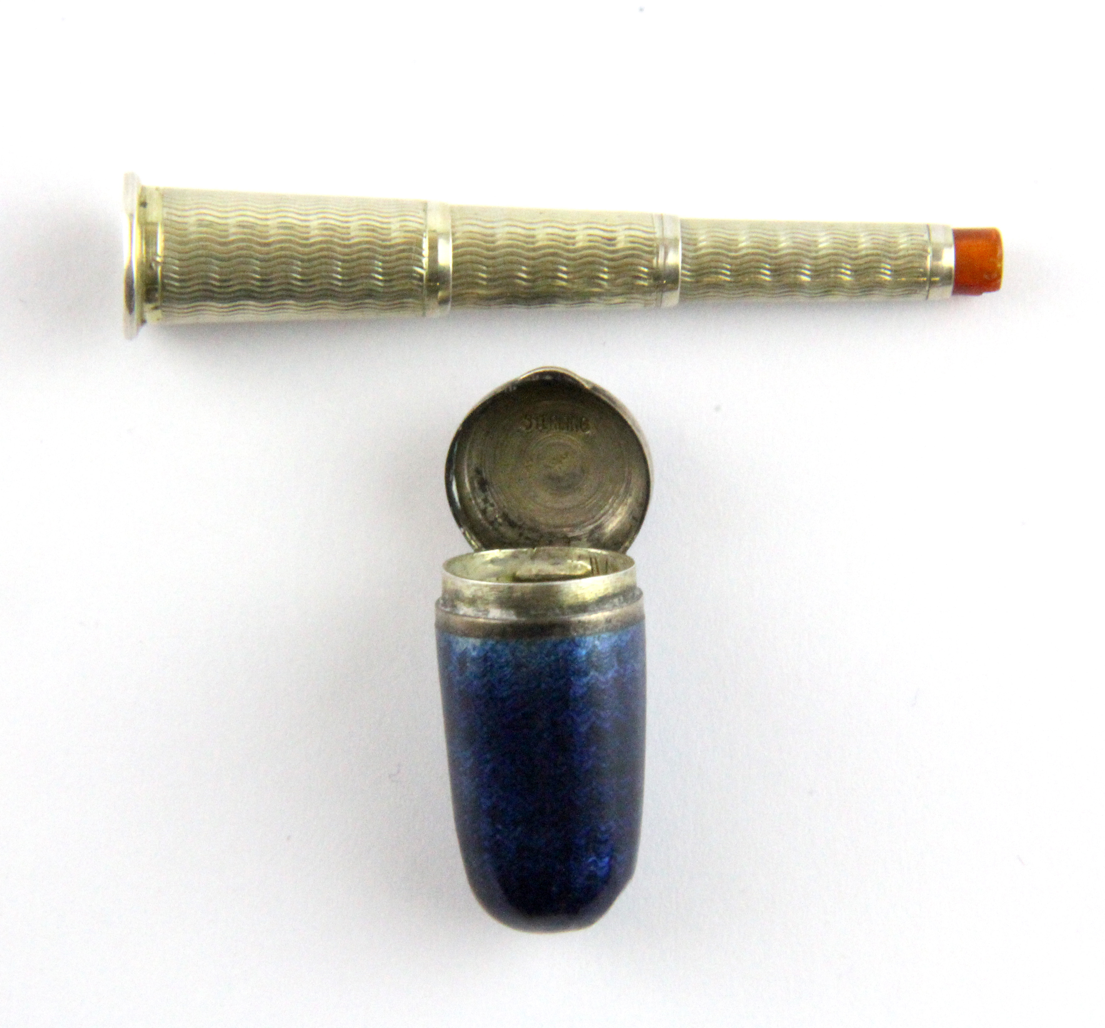 An enamelled white metal cased telescopic cheroot holder, case L. 3cm.